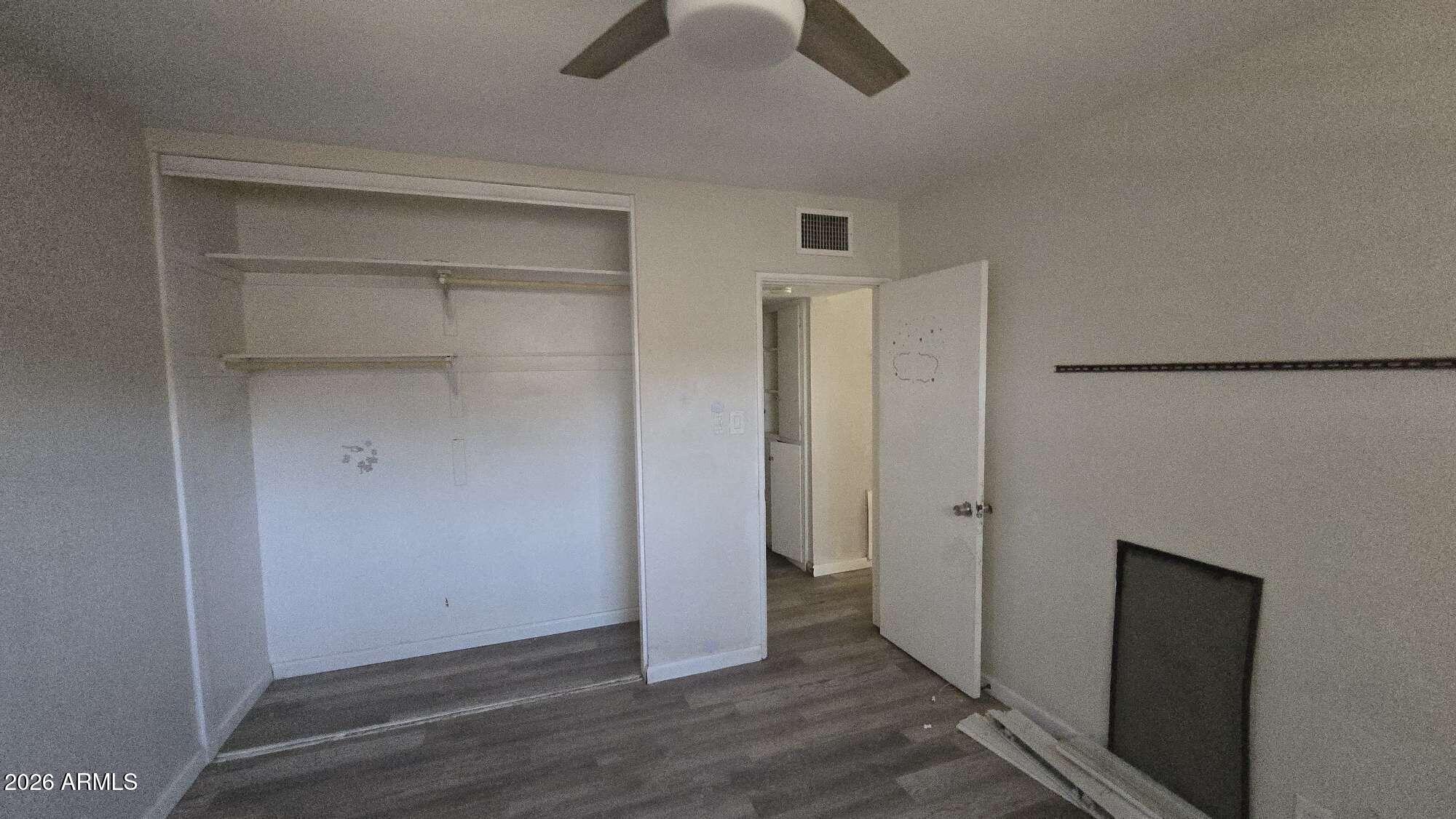 834 West Osborn Road Phoenix, AZ 85013 - Photo 39 of 45 a view of empty room with wooden floor