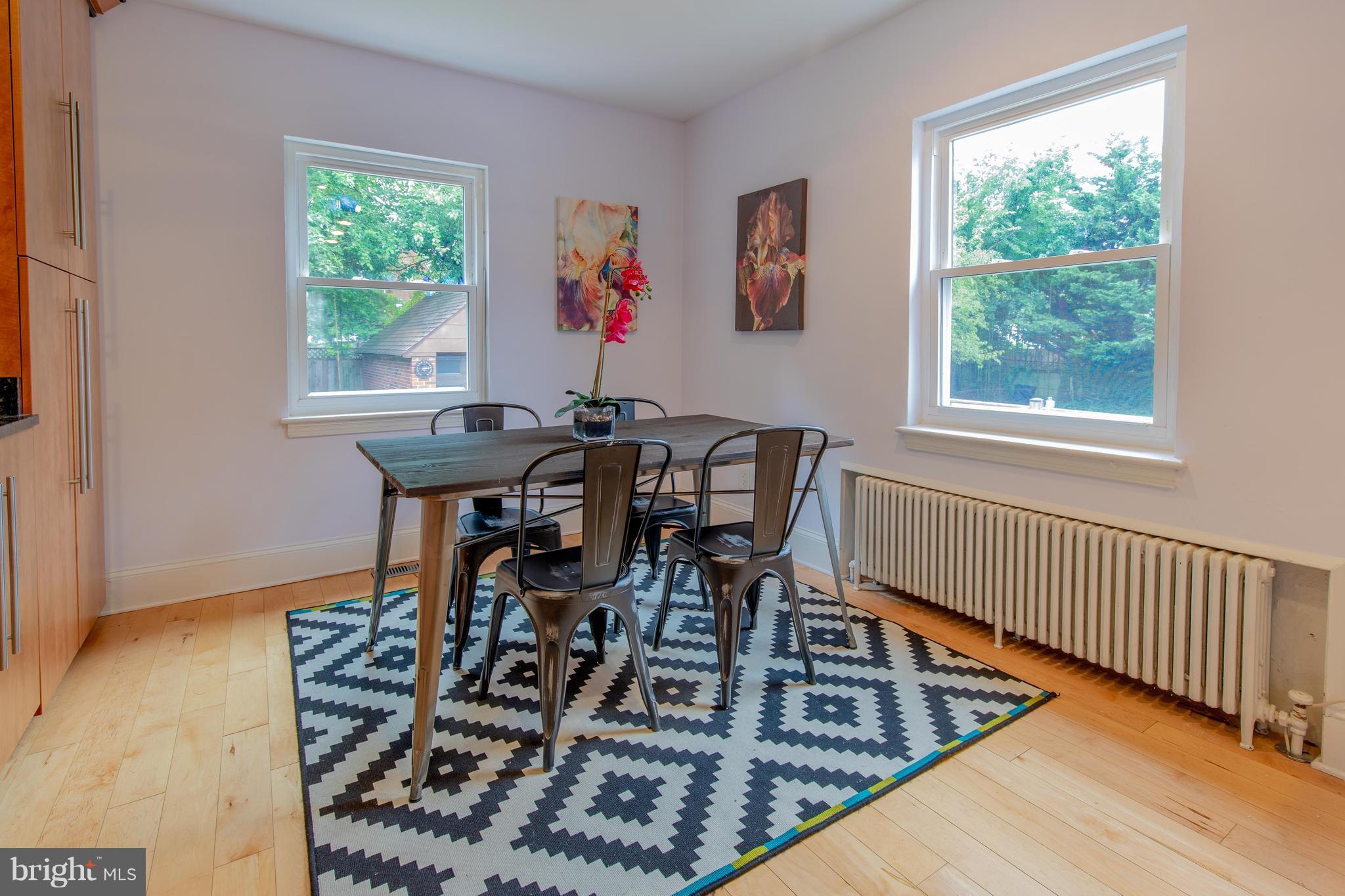 9940 Moss Avenue Silver Spring, MD 20901 - Photo 14 of 30 a view of a dining room with furniture and a window