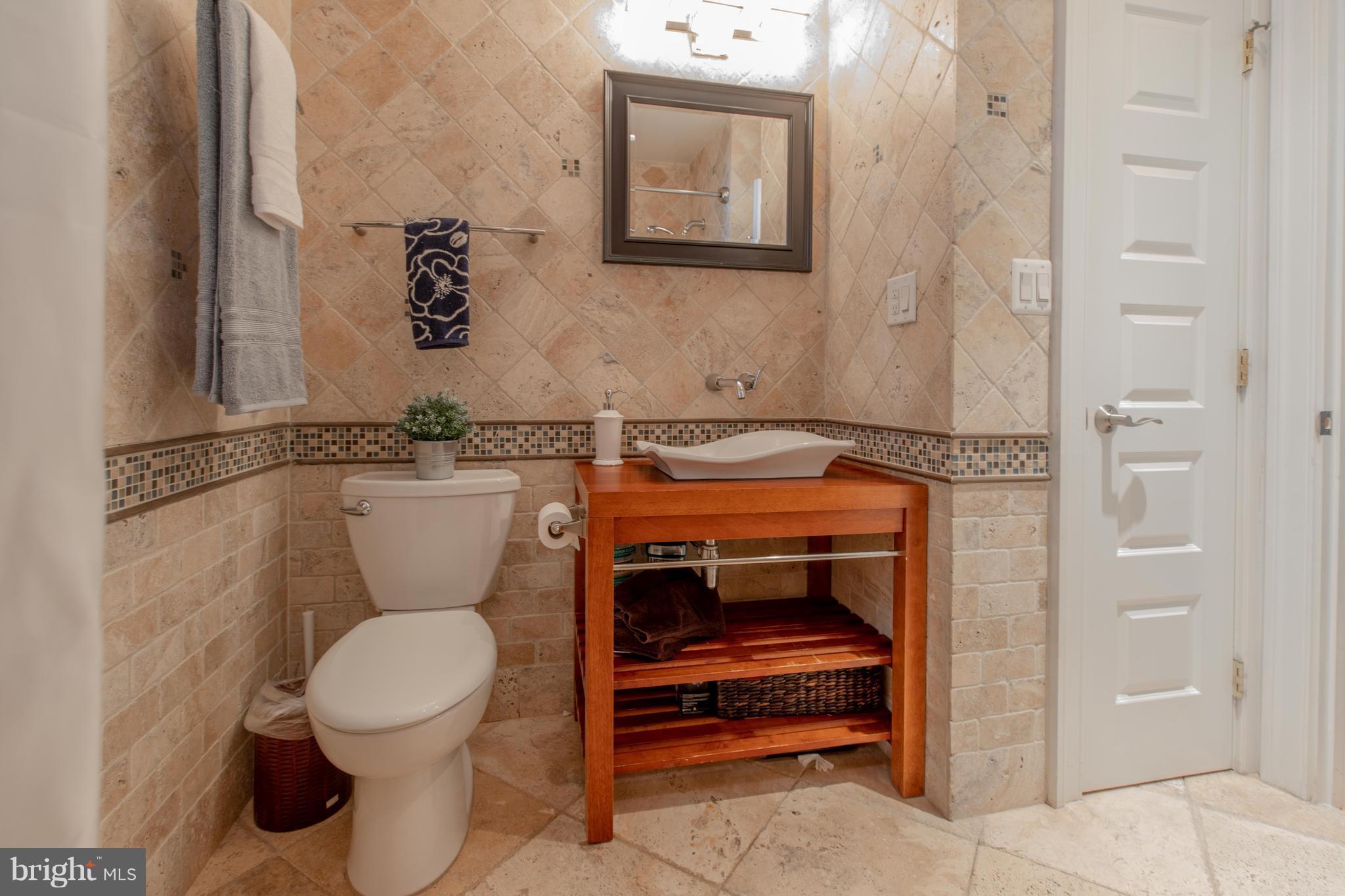 9940 Moss Avenue Silver Spring, MD 20901 - Photo 19 of 30 a bathroom with a toilet and a sink