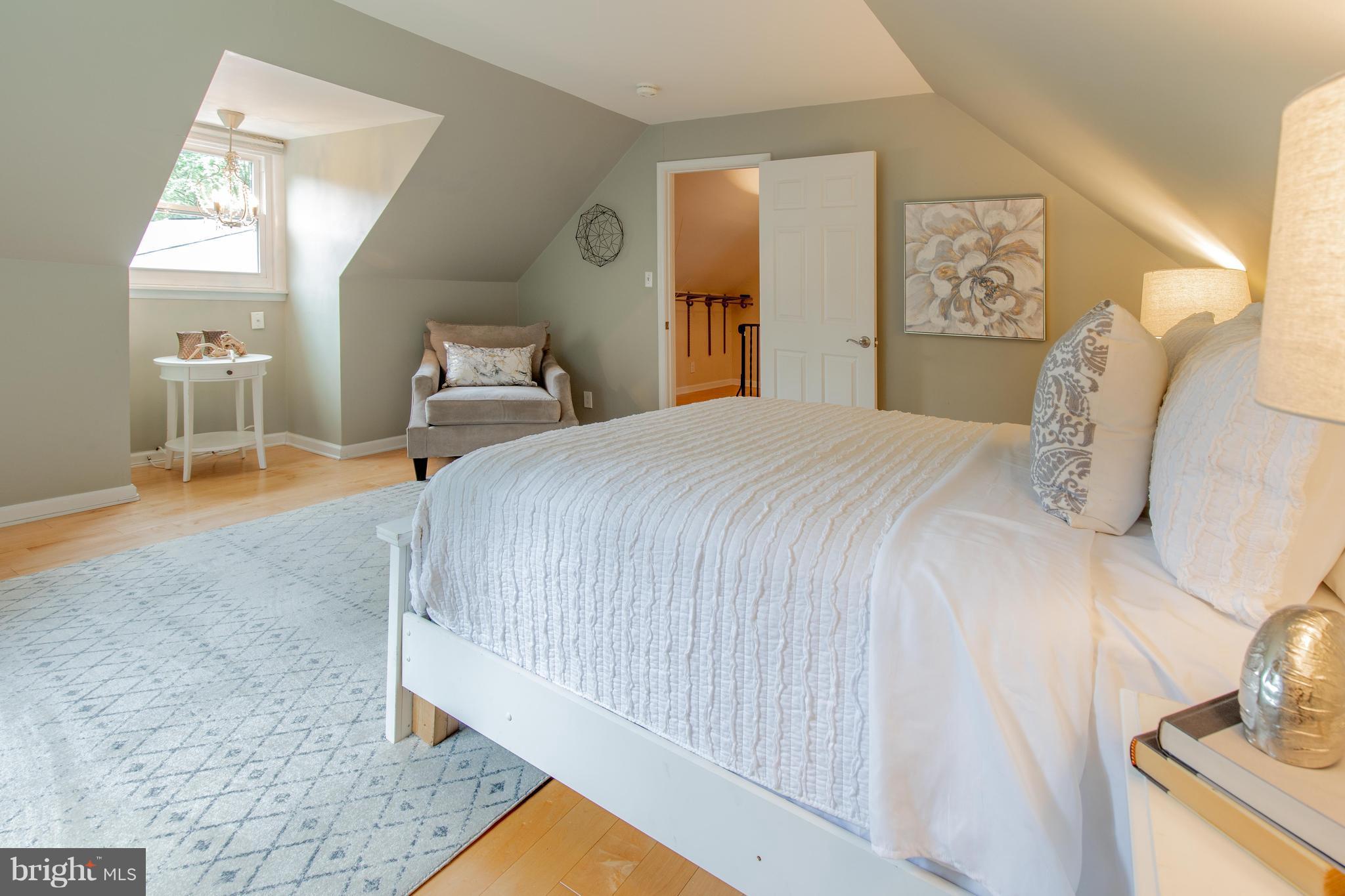 9940 Moss Avenue Silver Spring, MD 20901 - Photo 21 of 30 a bedroom with a bed and a mirror