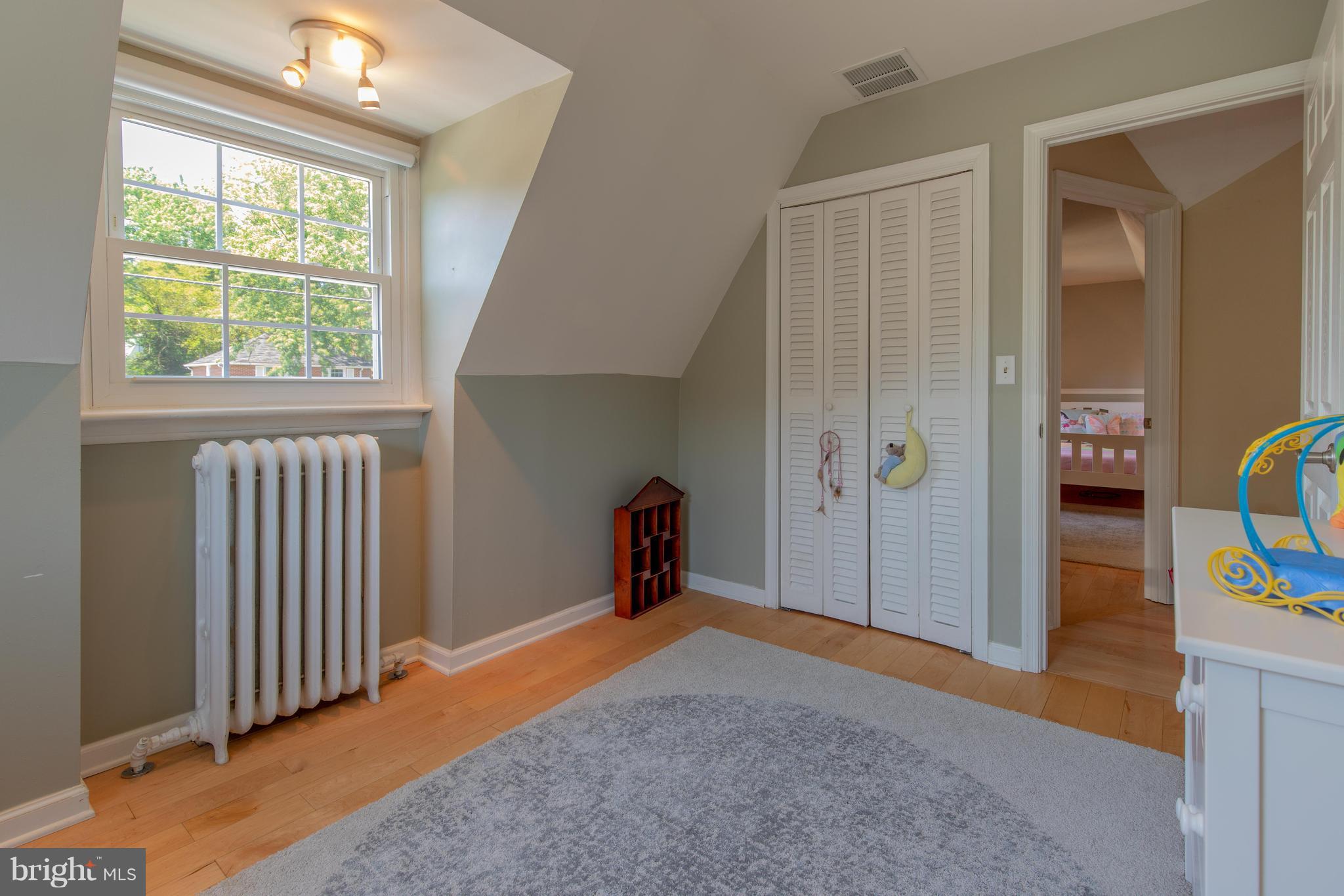 9940 Moss Avenue Silver Spring, MD 20901 - Photo 25 of 30 a view of a room that has a bed and a window
