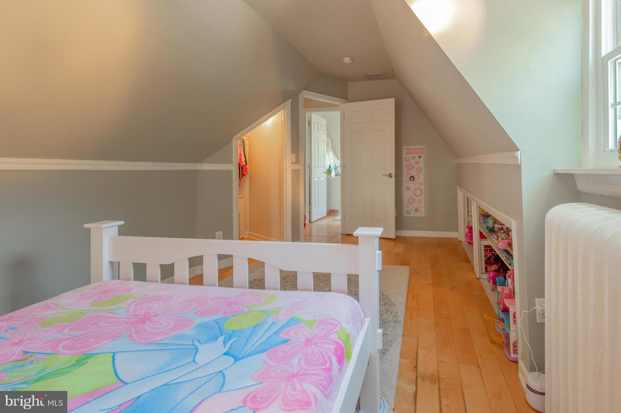 9940 Moss Avenue Silver Spring, MD 20901 - Photo 27 of 30 a bedroom with a bed and a table