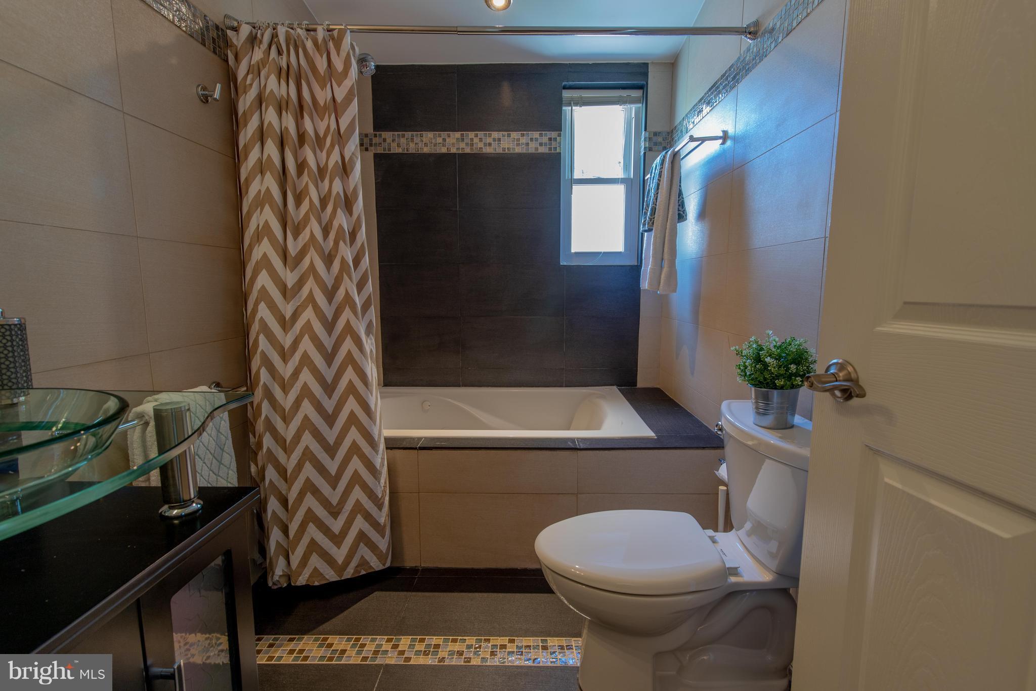 9940 Moss Avenue Silver Spring, MD 20901 - Photo 30 of 30 a bathroom with a toilet and a shower