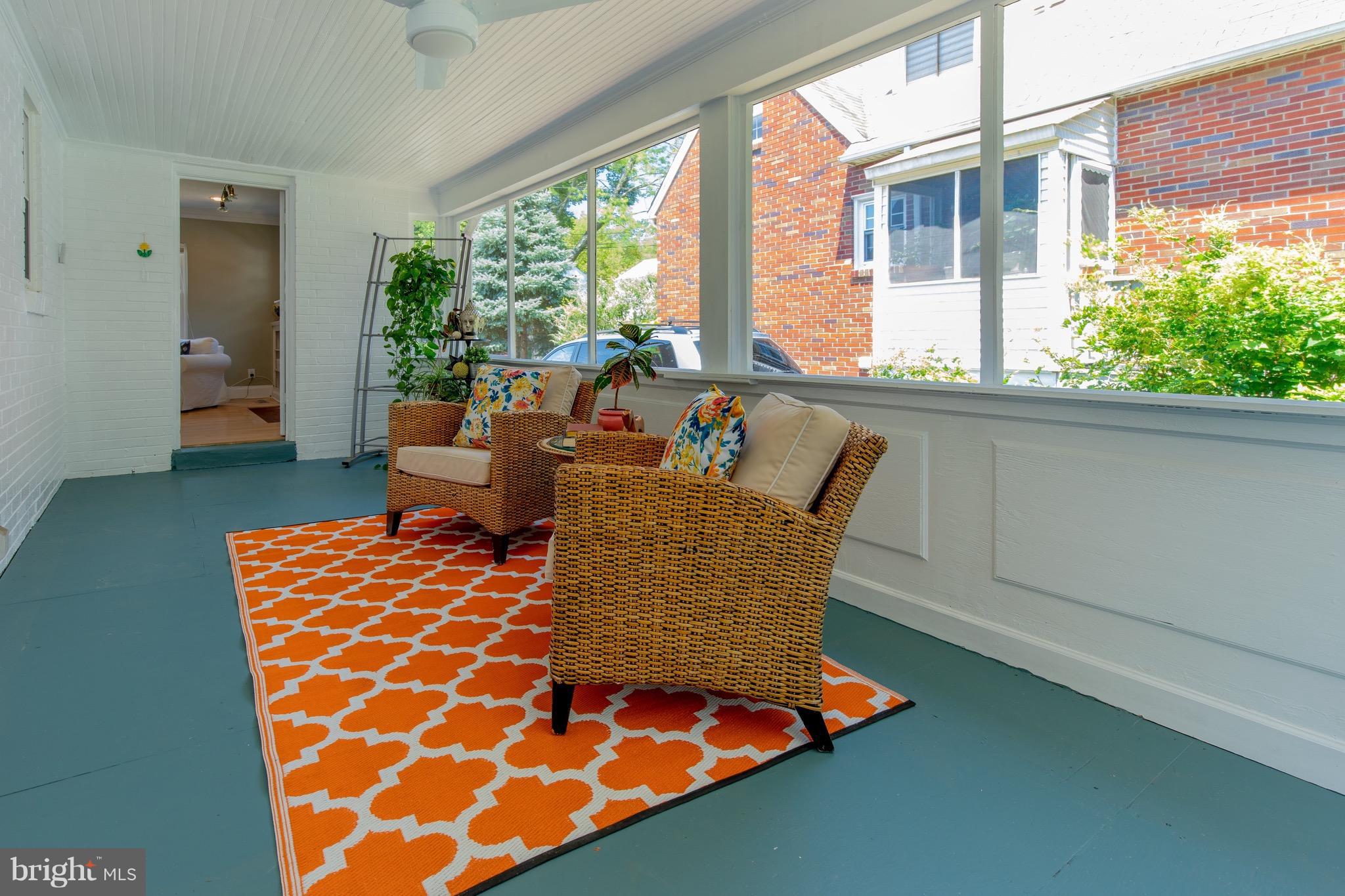 9940 Moss Avenue Silver Spring, MD 20901 - Photo 4 of 30 a living room with patio furniture and a large window
