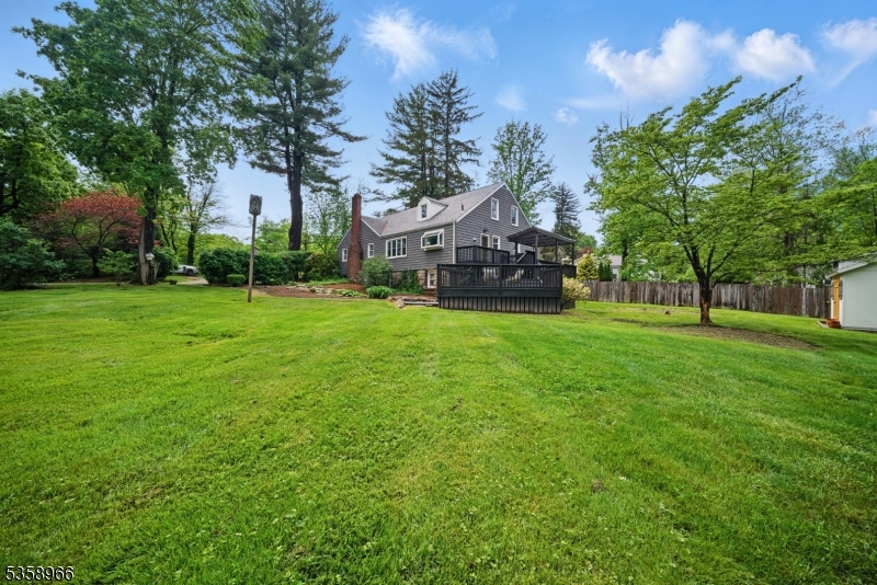 351 Franklin Road Denville, NJ 07834 - Photo 1 of 48 a view of a house with a big yard and large trees