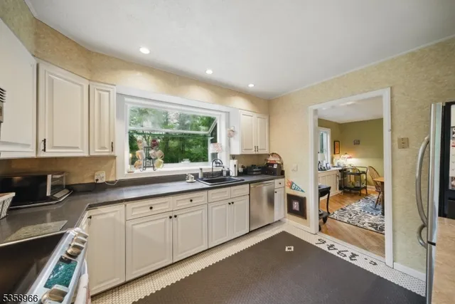 a kitchen with sink and cabinets