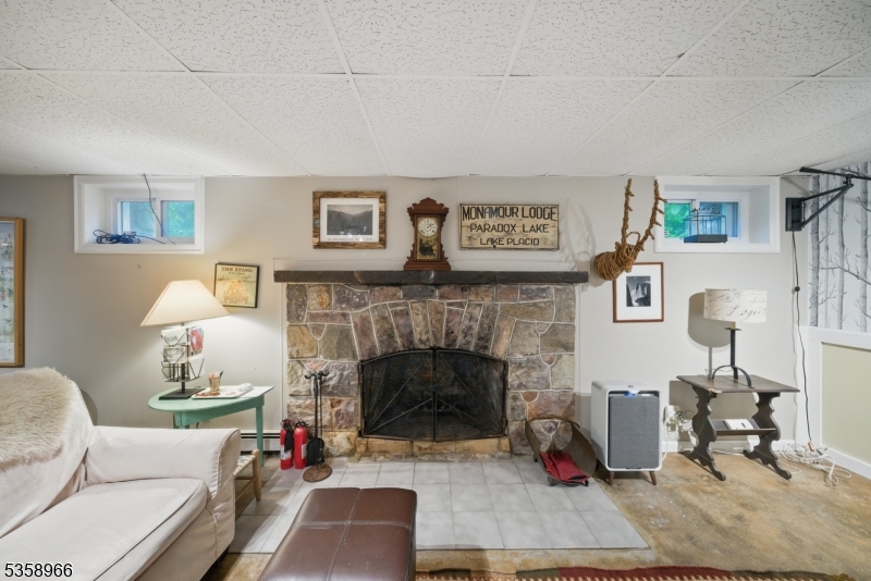 351 Franklin Road Denville, NJ 07834 - Photo 20 of 48 a living room with furniture and a fireplace