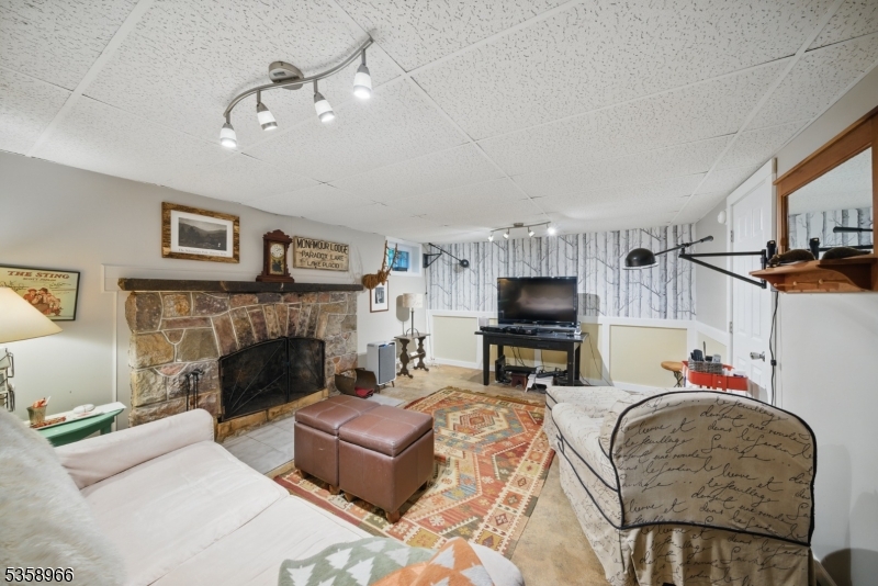 351 Franklin Road Denville, NJ 07834 - Photo 21 of 48 a living room with furniture and a fireplace