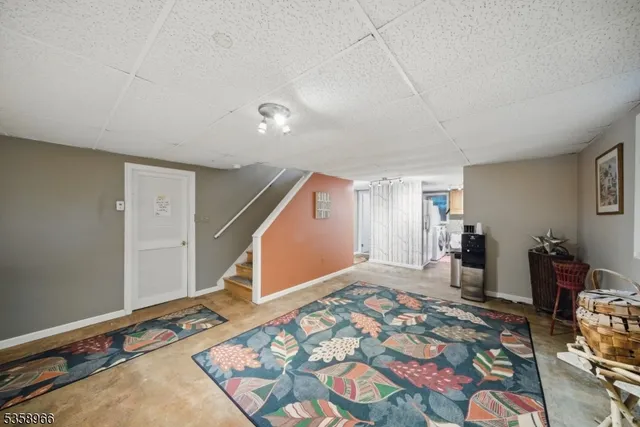 a bedroom with bed and mirror