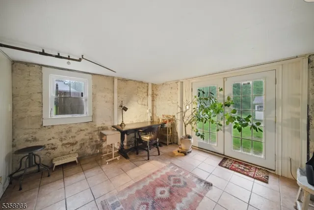 a view of a livingroom with furniture and front door