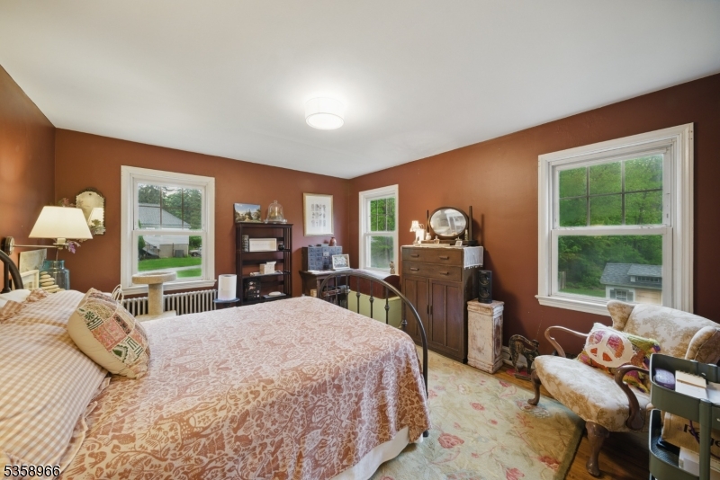 351 Franklin Road Denville, NJ 07834 - Photo 38 of 48 a bedroom with a large bed and a large window