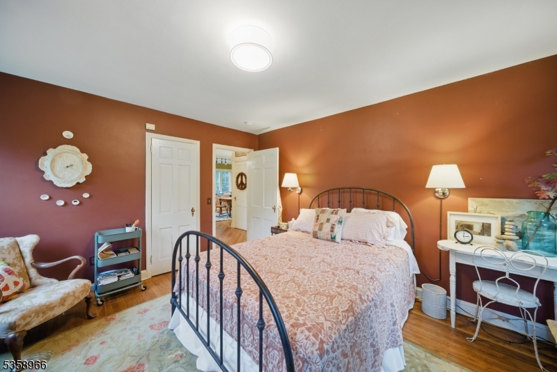 351 Franklin Road Denville, NJ 07834 - Photo 39 of 48 a bedroom with a bed and wooden floor