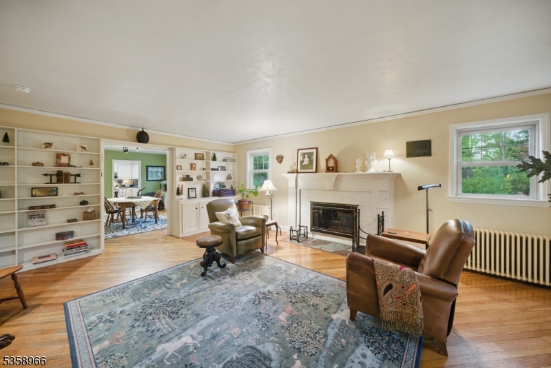 351 Franklin Road Denville, NJ 07834 - Photo 6 of 48 a living room with furniture and a fireplace