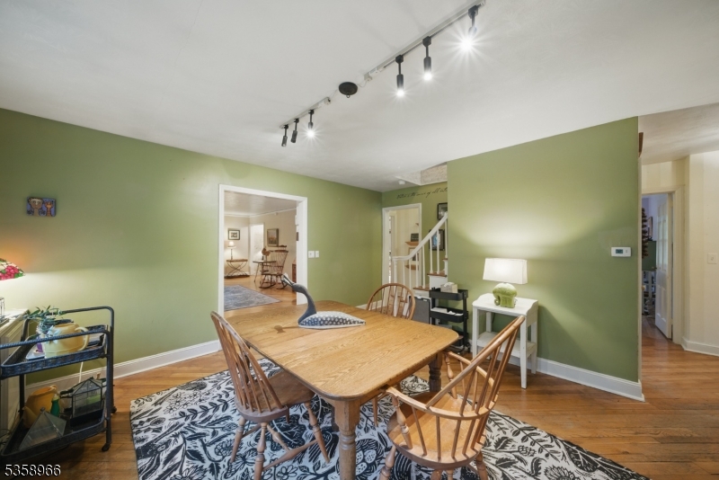 351 Franklin Road Denville, NJ 07834 - Photo 9 of 48 a view of a dining room with furniture and wooden floor