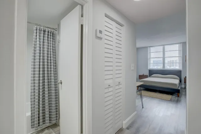 a bathroom with a bathtub and a shower
