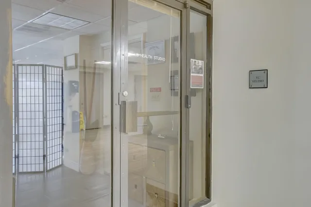 a dining room with furniture and a clock