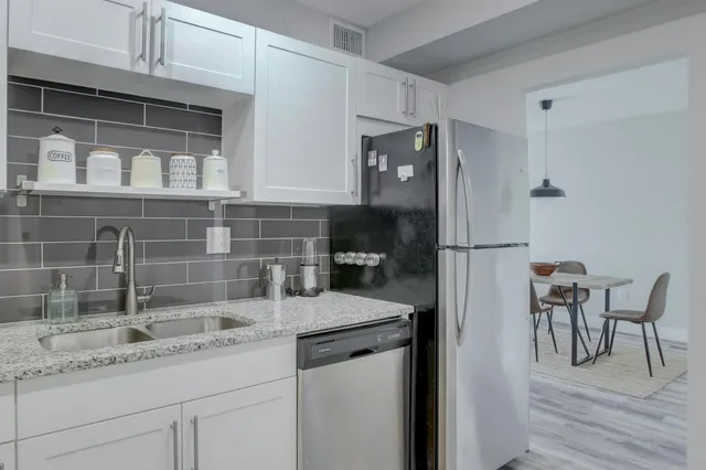 a view of a livingroom with furniture and window