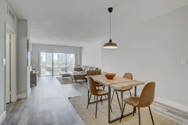 a view of a dining room with furniture window and outside view