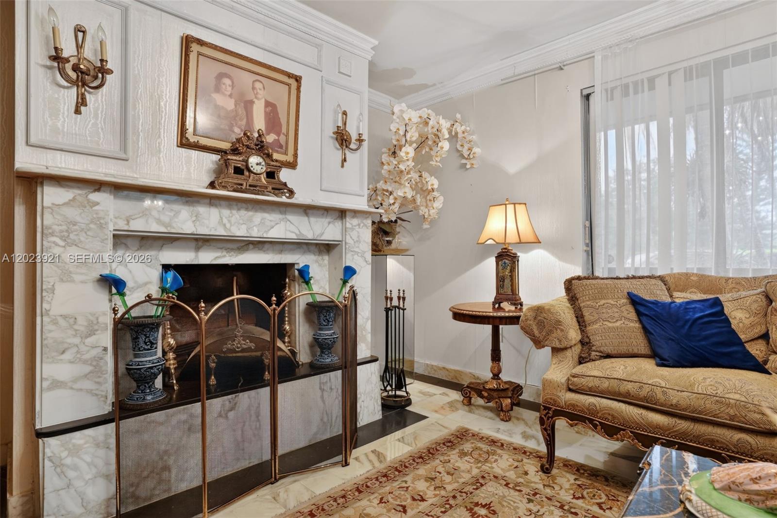 8461 Southwest 68th St Road Miami, FL 33143 - Photo 35 of 65 a living room with furniture and a fireplace