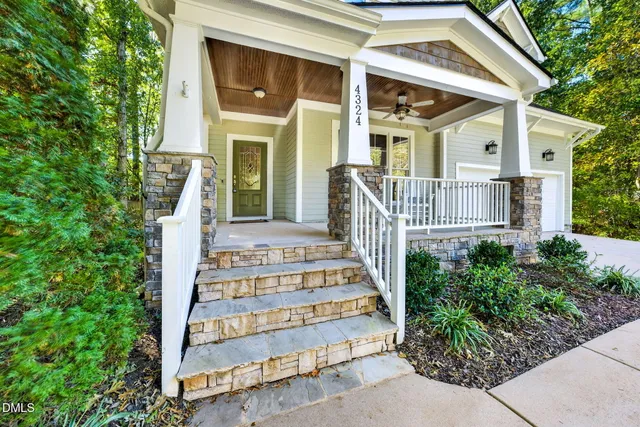 front view of a house with a bench