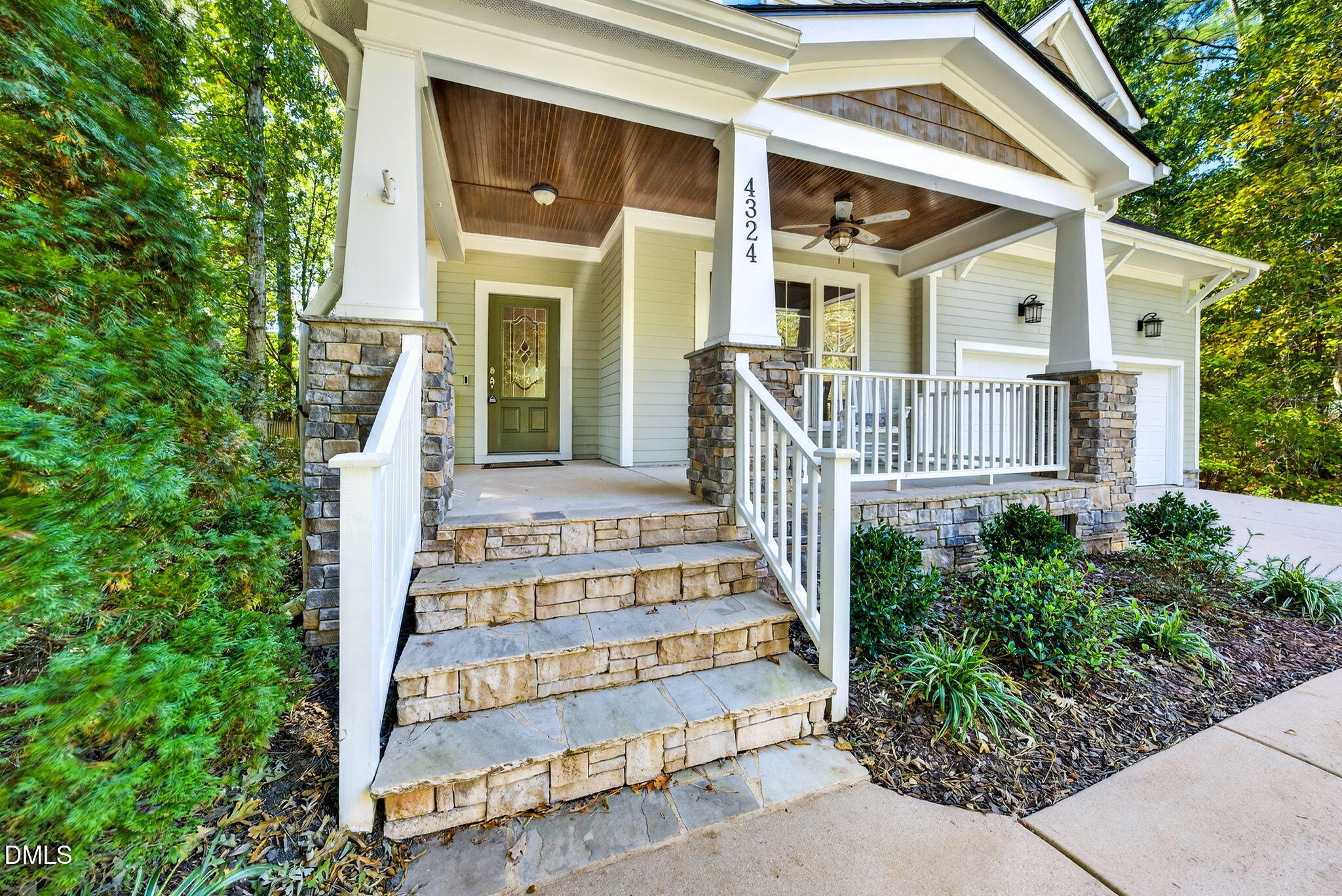 4324 Brighton Ridge Drive Apex, NC 27539 - Photo 1 of 37 front view of a house with a bench