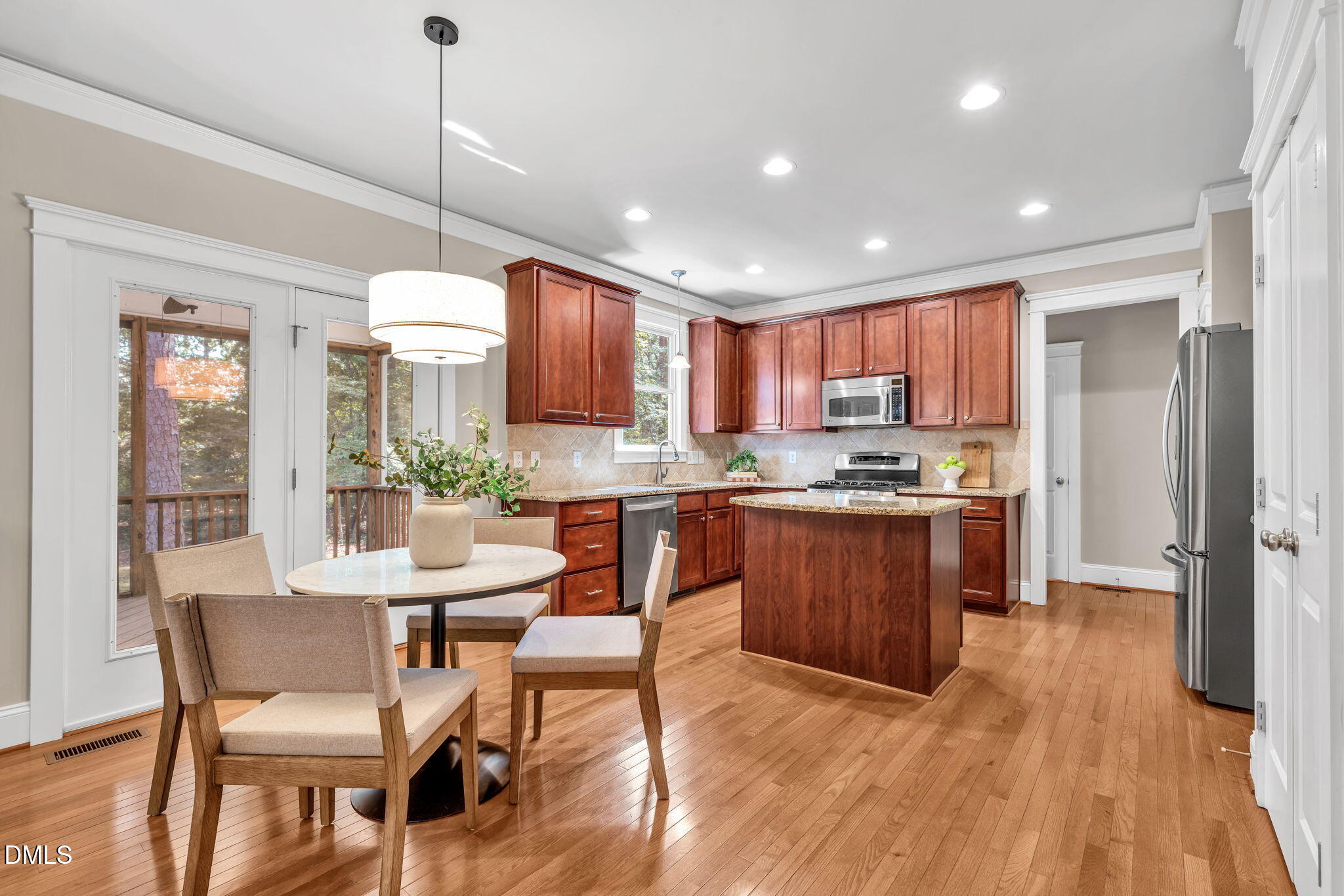 4324 Brighton Ridge Drive Apex, NC 27539 - Photo 11 of 37 a kitchen with a sink appliances and wooden floor