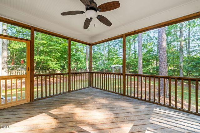 a view of a room with wooden floor and balcony