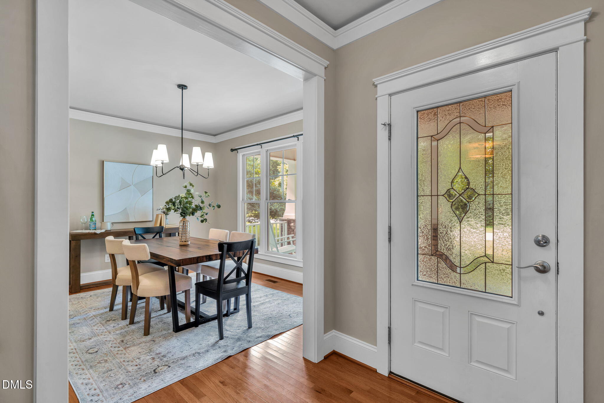 4324 Brighton Ridge Drive Apex, NC 27539 - Photo 3 of 37 a view of a dining room with furniture window and wooden floor