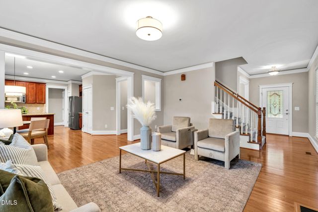 a living room with furniture or couch and a dining table