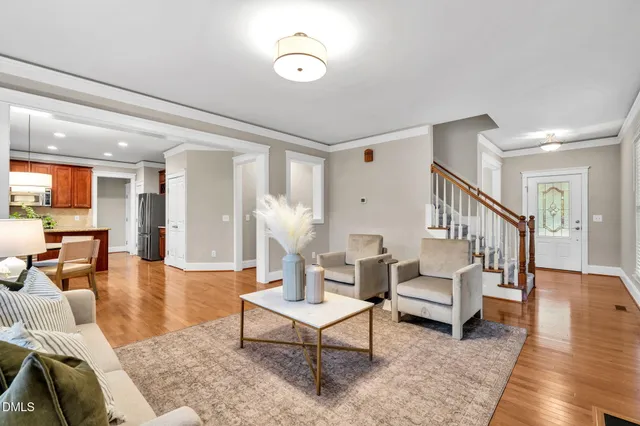 a living room with furniture or couch and a dining table