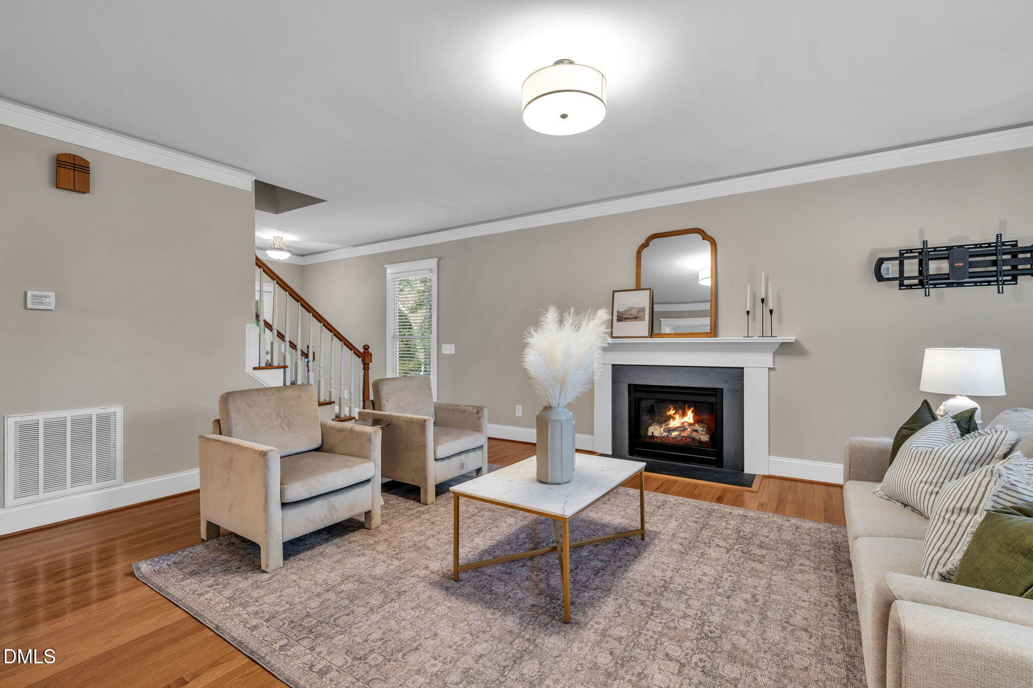 4324 Brighton Ridge Drive Apex, NC 27539 - Photo 10 of 37 a living room with furniture and a fireplace