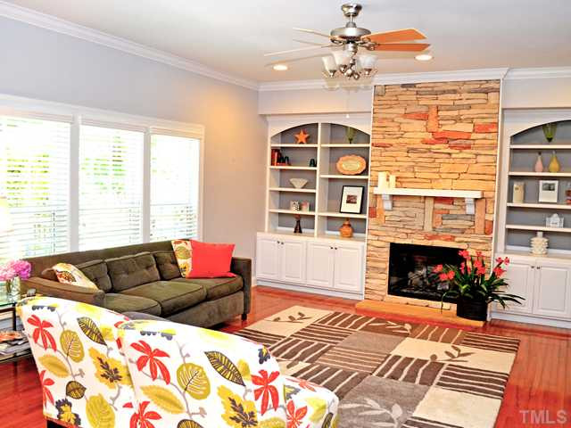 1050 Barnford Mill Road Wake Forest, NC 27587 - Photo 13 of 25 Open Family Room w/ Stacked Stone Fireplace, Built-Ins & Hardwood Floor Den/Family/Great Room