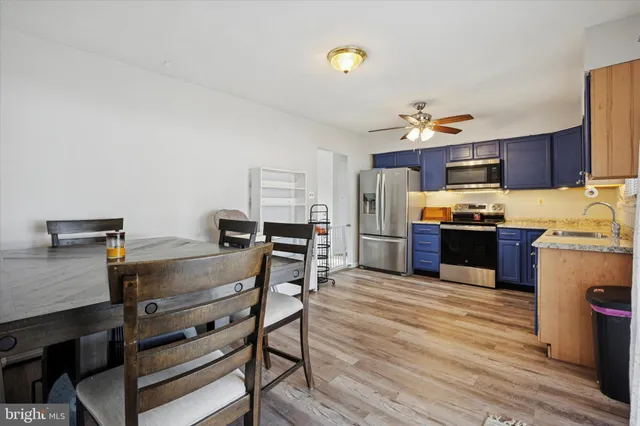 a kitchen with stainless steel appliances a stove and a refrigerator