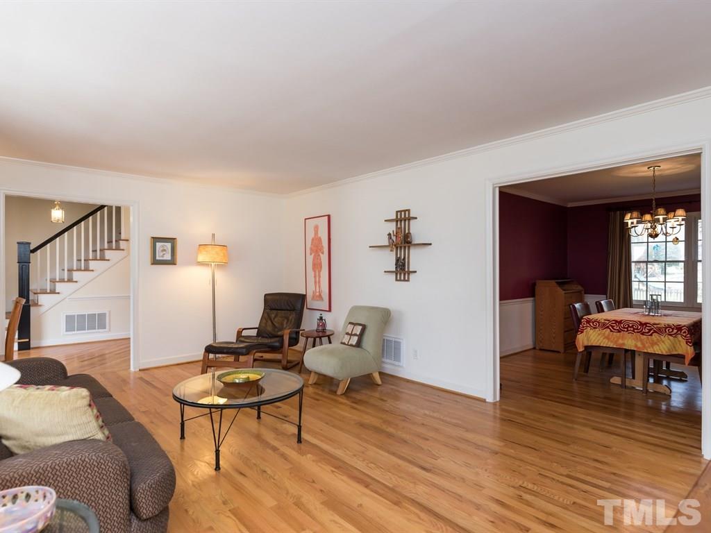 1213 Hunting Ridge Road Raleigh, NC 27615 - Photo 7 of 25 a living room with furniture and wooden floor