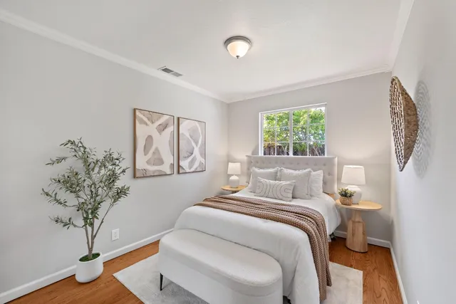 a bedroom with a large bed and a window