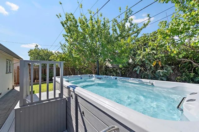 a view of a backyard with sitting area