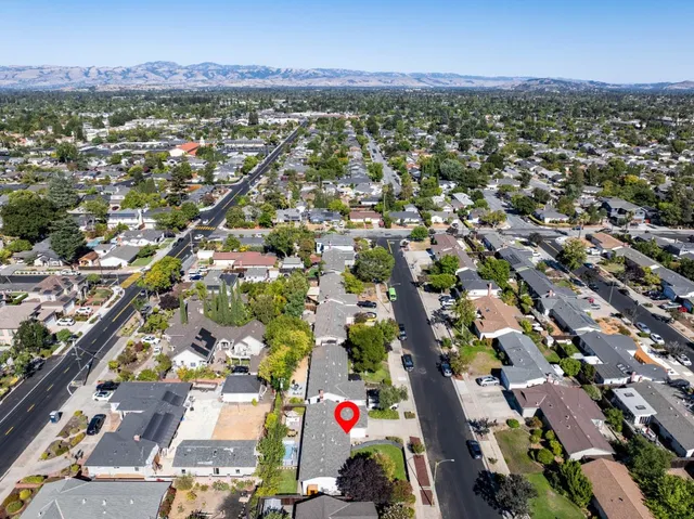a picture of a wall with a white wall and a white refrigerator