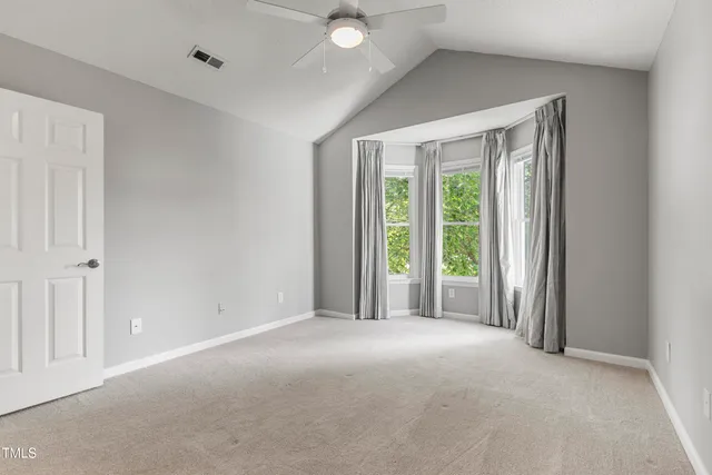 a view of a room with a large window