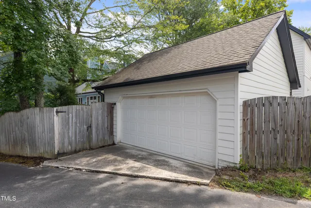 a view of a house with wooden deck front of house