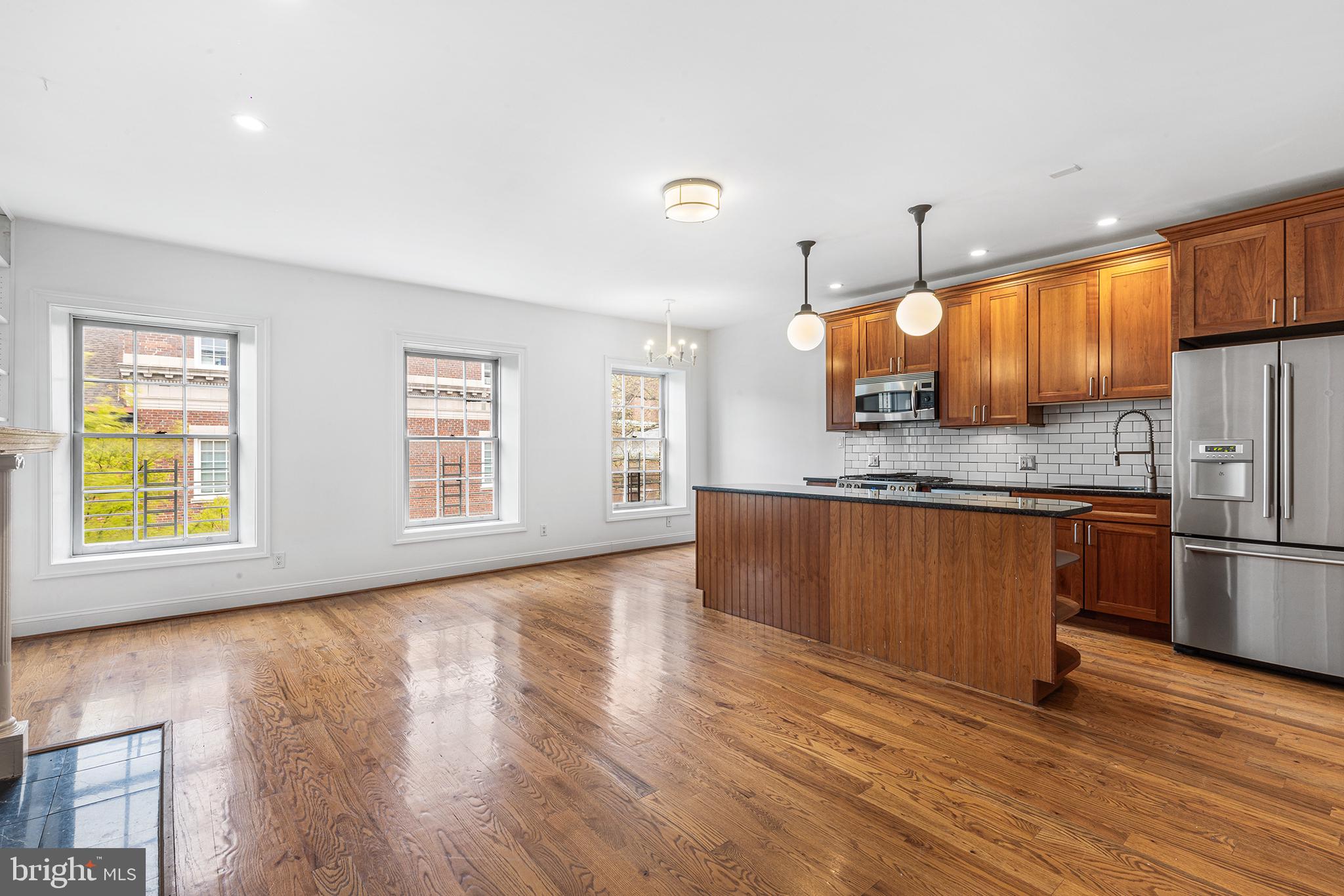 902 Pine Street, Unit 3F Philadelphia, PA 19107 - Photo 8 of 22 a view of kitchen with stainless steel appliances granite countertop a stove a sink and a refrigerator