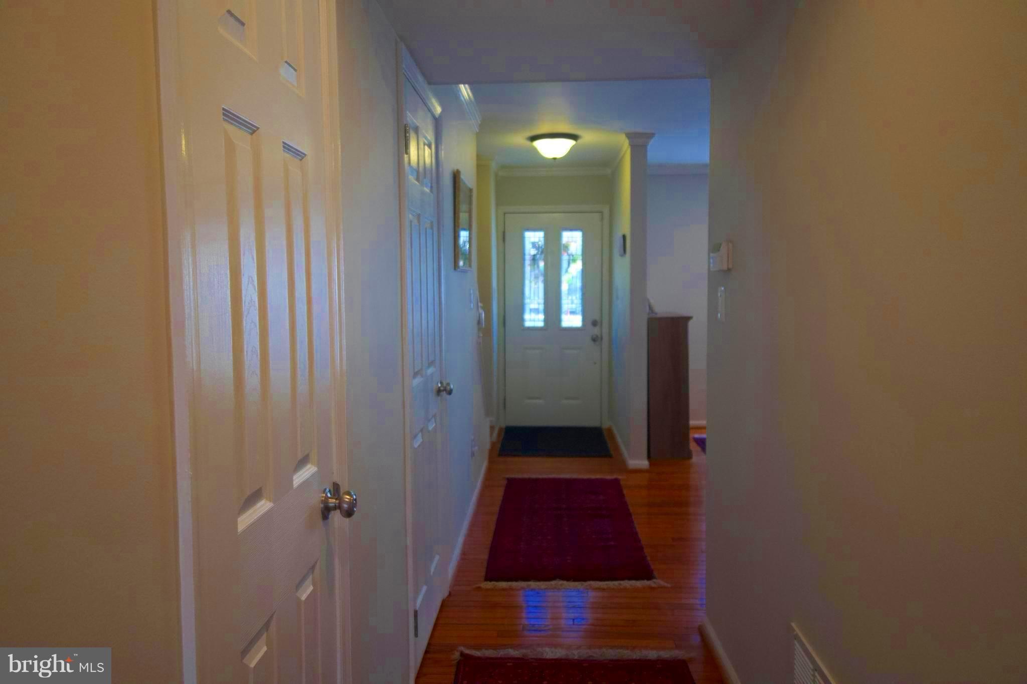 6261 Rathlin Drive Springfield, VA 22152 - Photo 10 of 26 a room that has a rug and a mirror