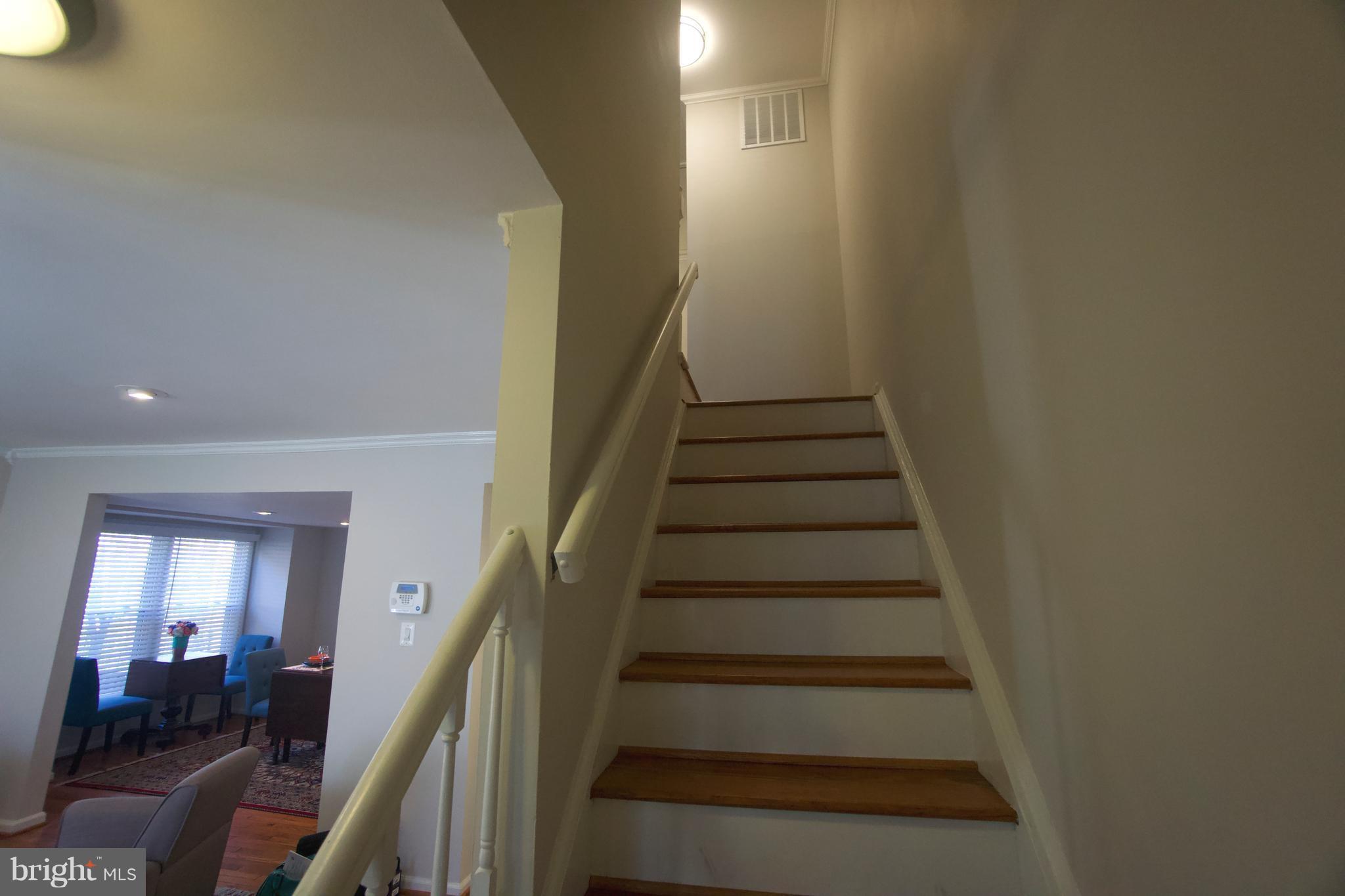 6261 Rathlin Drive Springfield, VA 22152 - Photo 12 of 26 a view of entryway and hall with wooden floor