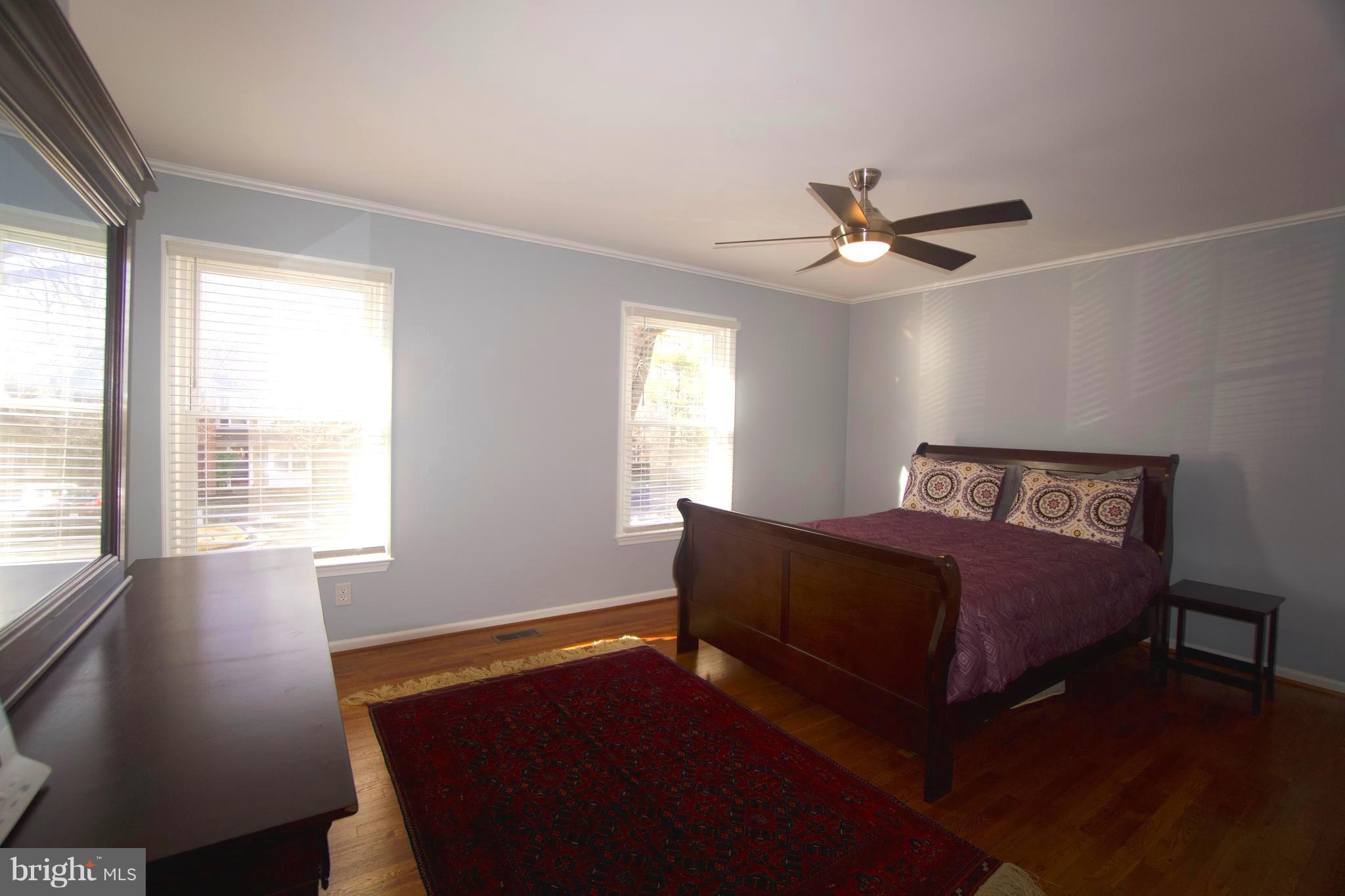 6261 Rathlin Drive Springfield, VA 22152 - Photo 14 of 26 a spacious bedroom with a bed and window