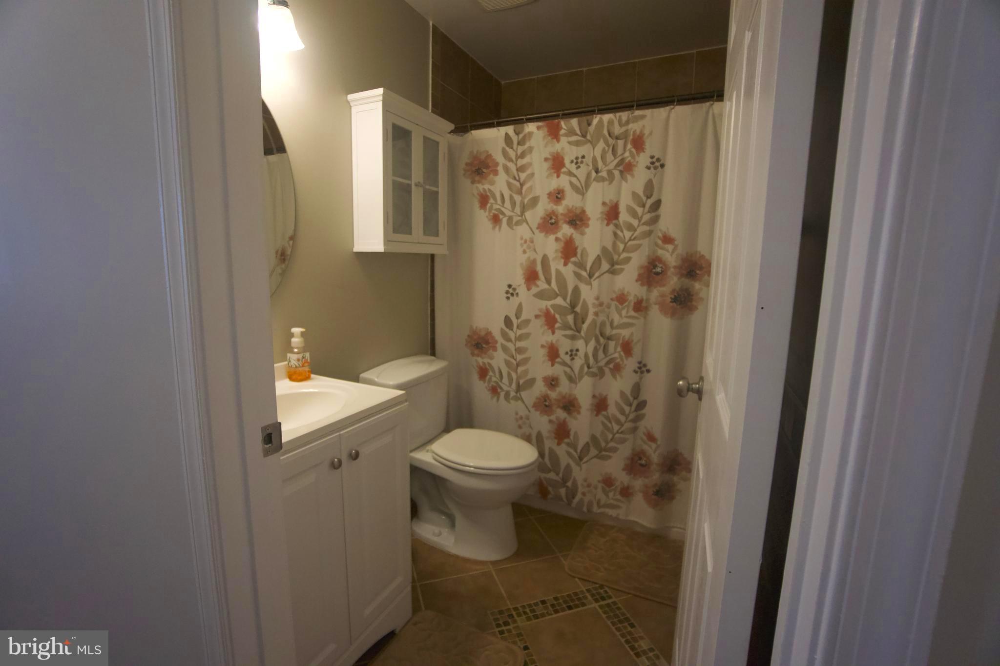 6261 Rathlin Drive Springfield, VA 22152 - Photo 15 of 26 a bathroom with a toilet and a shower
