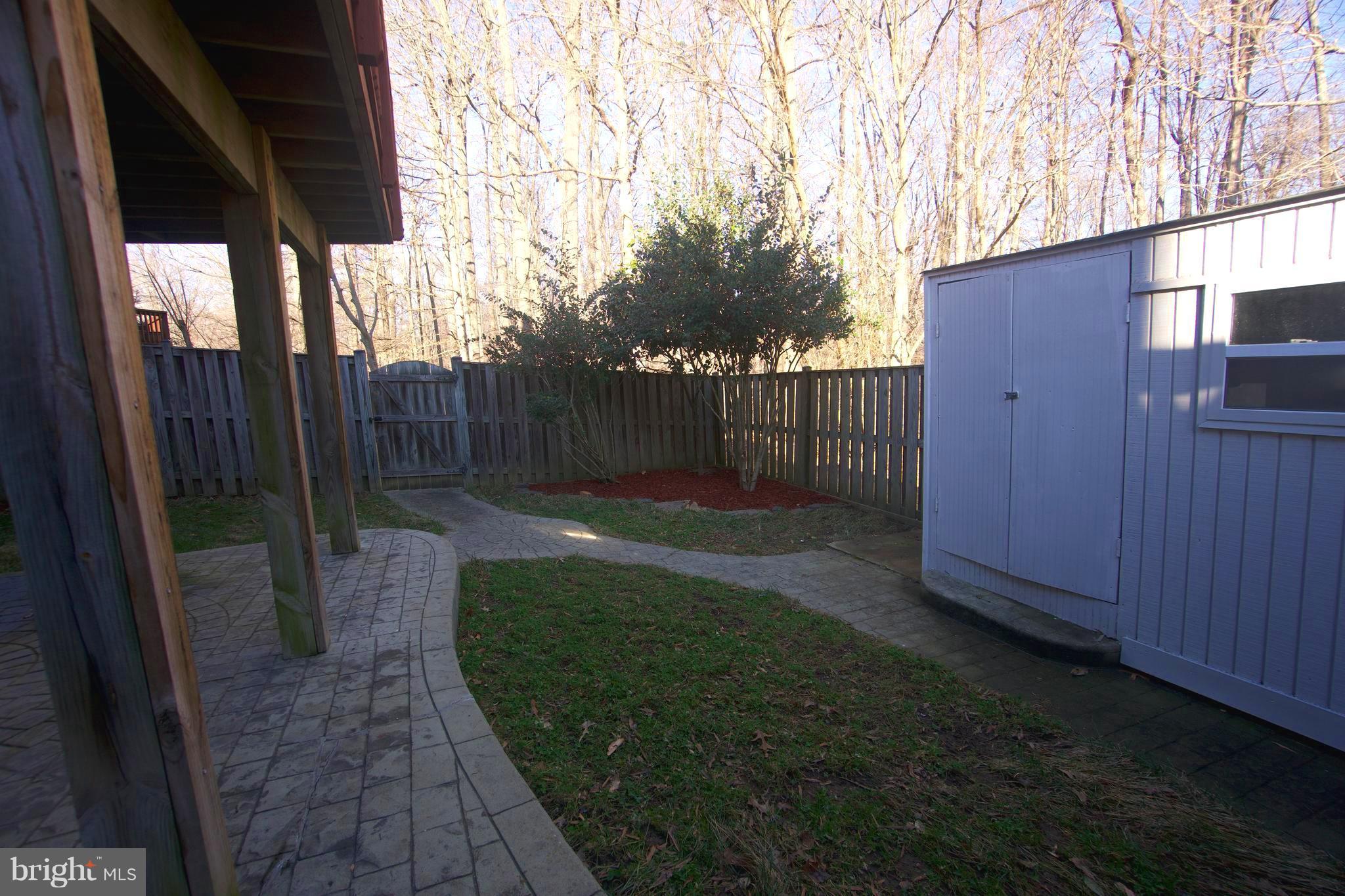 6261 Rathlin Drive Springfield, VA 22152 - Photo 23 of 26 a view of a backyard with pathway