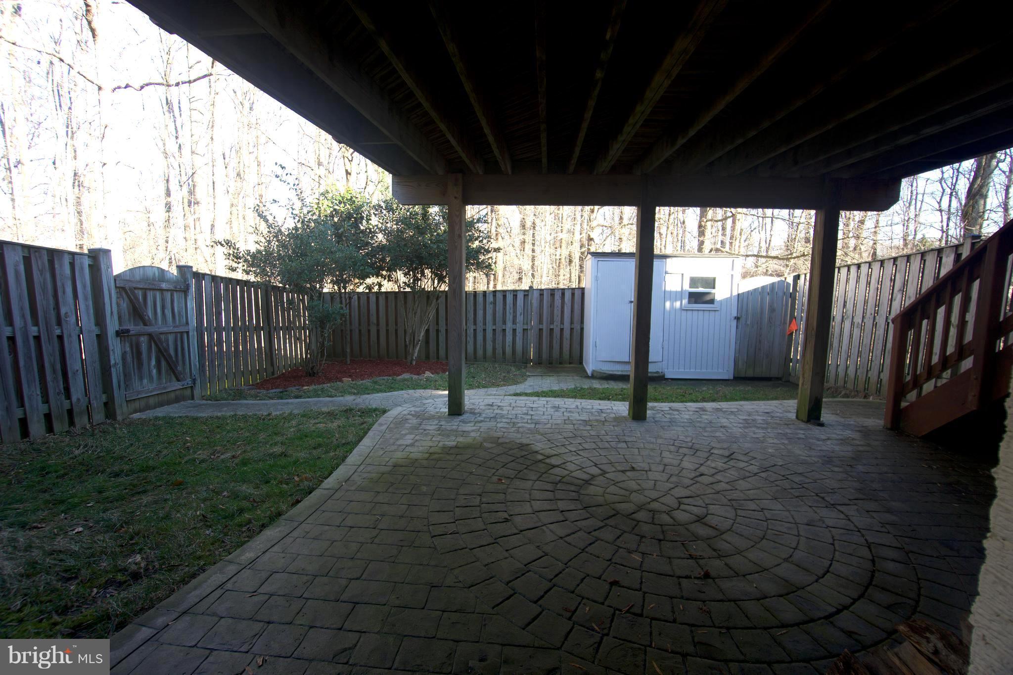 6261 Rathlin Drive Springfield, VA 22152 - Photo 24 of 26 a view of a backyard with fence