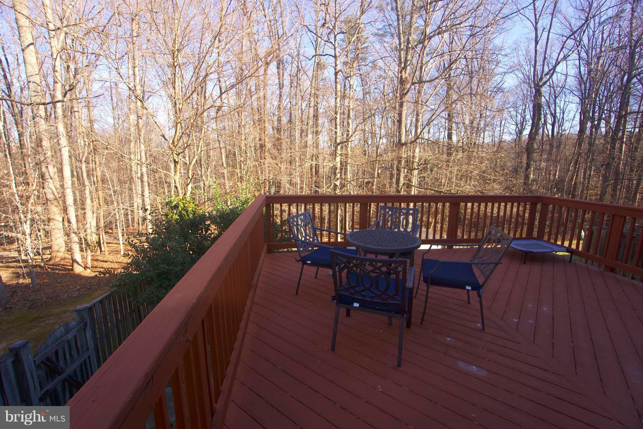 6261 Rathlin Drive Springfield, VA 22152 - Photo 25 of 26 a view of balcony with wooden floor and seating