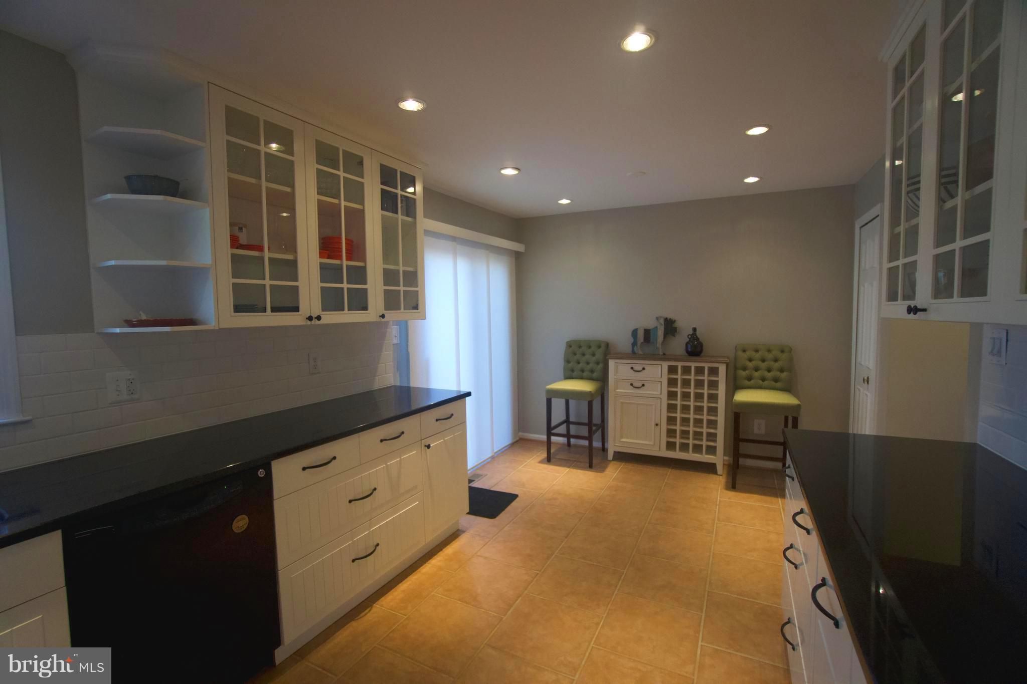 6261 Rathlin Drive Springfield, VA 22152 - Photo 9 of 26 a kitchen with a refrigerator and a sink