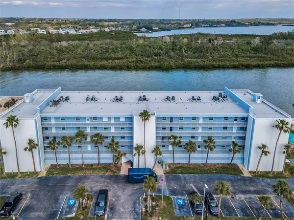 an aerial view of a house with a lake view