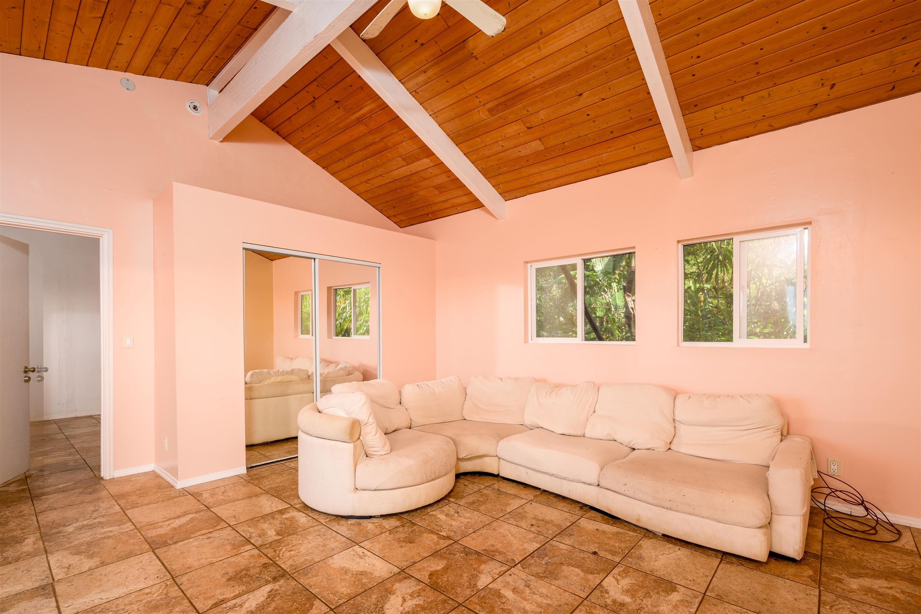 810 Upper Ulumalu Road Haiku, HI 96708 - Photo 40 of 46 a living room with furniture and a large window